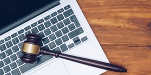 Judge gavel on computer.